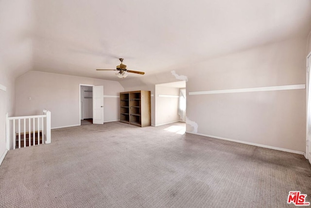 additional living space with carpet, ceiling fan, and lofted ceiling