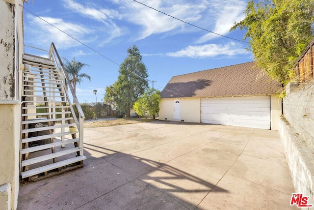 view of patio featuring a garage