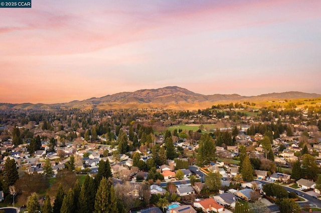 aerial view at dusk with a mountain view