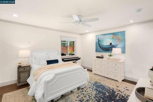 bedroom with hardwood / wood-style floors and ceiling fan