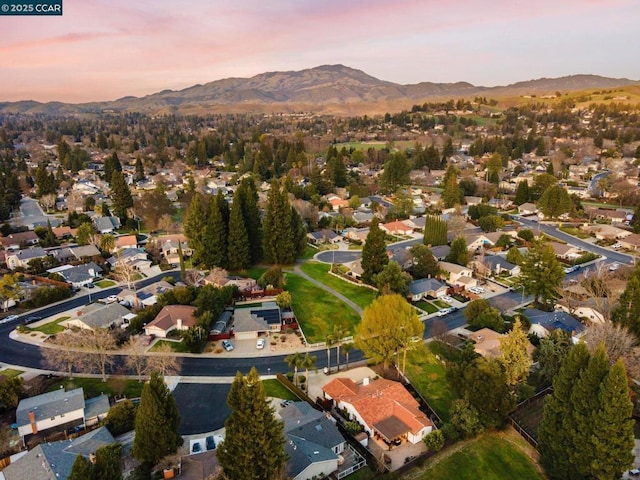 aerial view at dusk with a mountain view