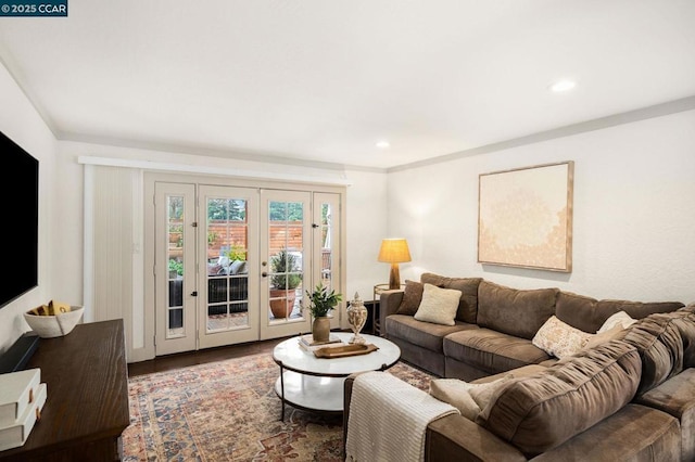 living room with hardwood / wood-style flooring and french doors