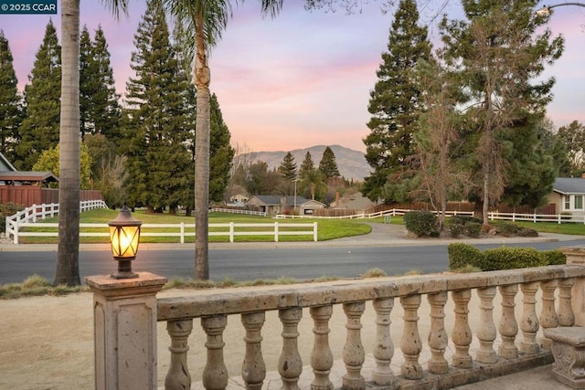 view of property's community featuring a mountain view and a yard