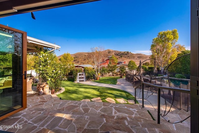 view of patio / terrace featuring a mountain view