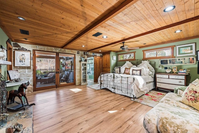 bedroom with beam ceiling, light hardwood / wood-style floors, and wooden ceiling