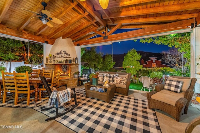 view of patio featuring an outdoor living space with a fireplace, ceiling fan, and a gazebo