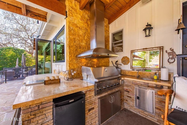 view of patio / terrace with area for grilling and sink