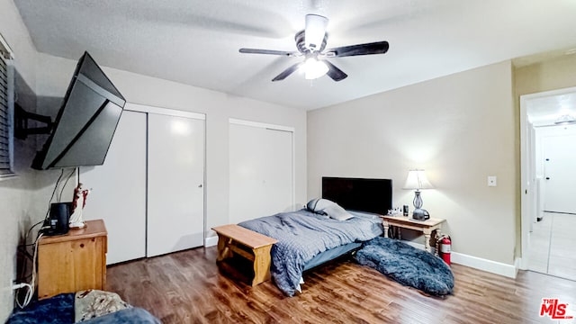 bedroom featuring dark hardwood / wood-style floors and ceiling fan