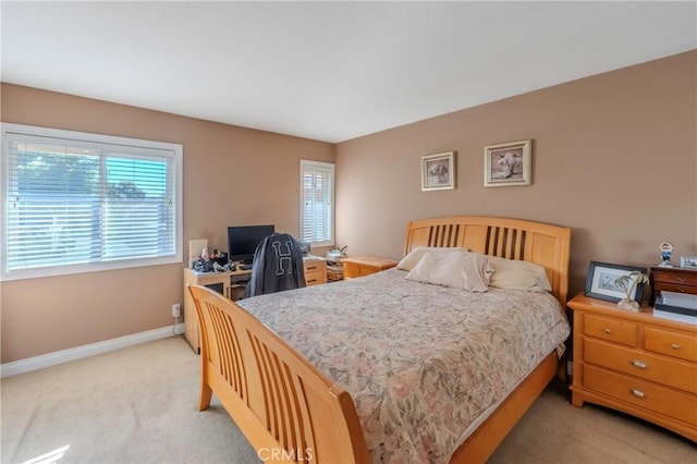 bedroom with light colored carpet