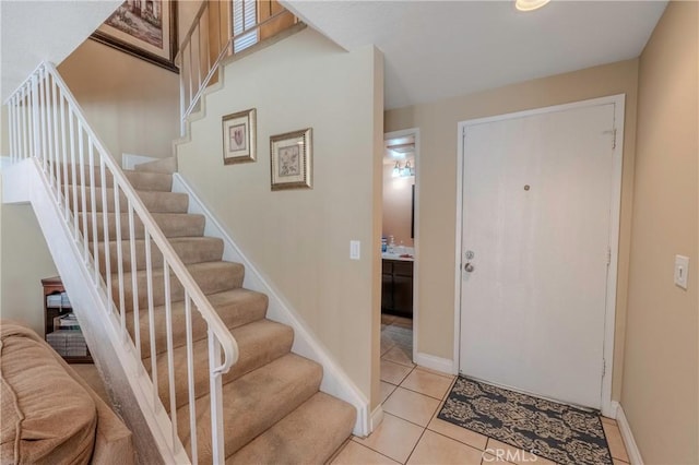 entrance foyer with light tile patterned flooring