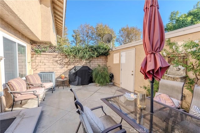 view of patio / terrace featuring central AC and a grill