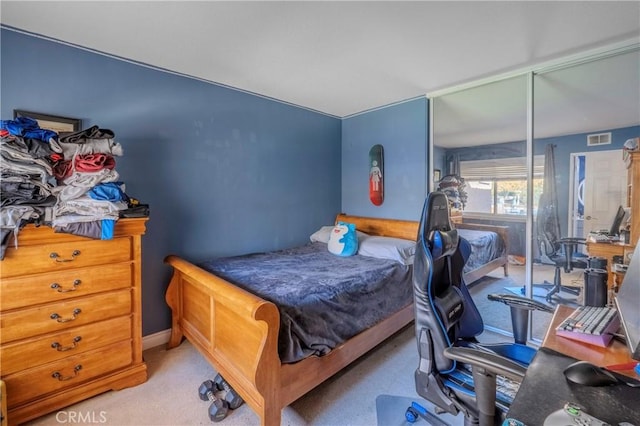 carpeted bedroom with a closet