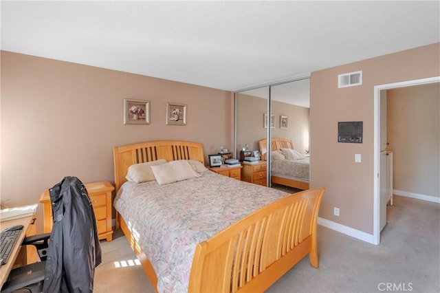 carpeted bedroom with a closet