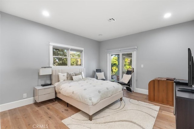 bedroom with light hardwood / wood-style flooring