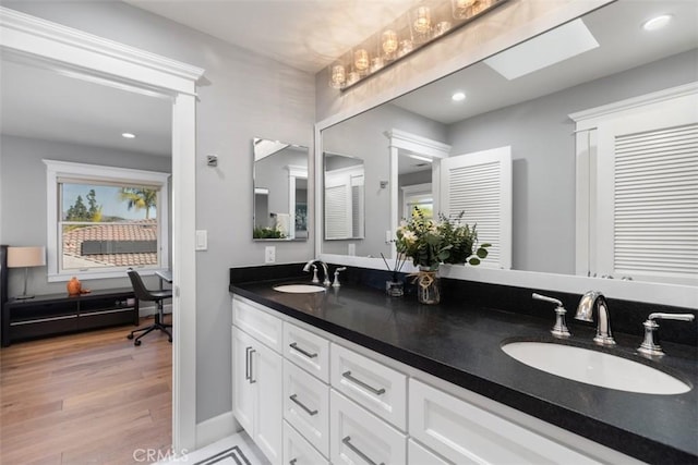 bathroom featuring wood-type flooring and vanity