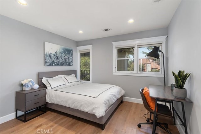 bedroom with light hardwood / wood-style floors