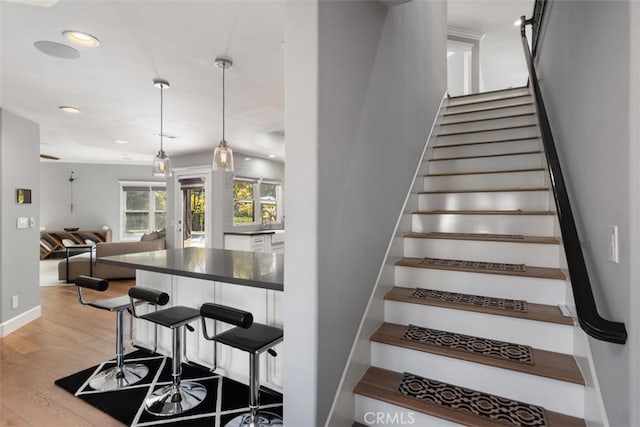 staircase featuring hardwood / wood-style flooring