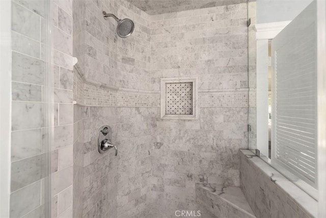 bathroom featuring a tile shower