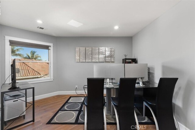 dining area with wood-type flooring