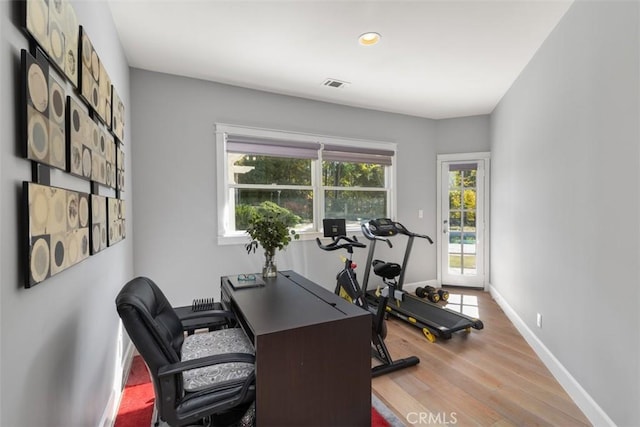 workout area featuring light hardwood / wood-style floors