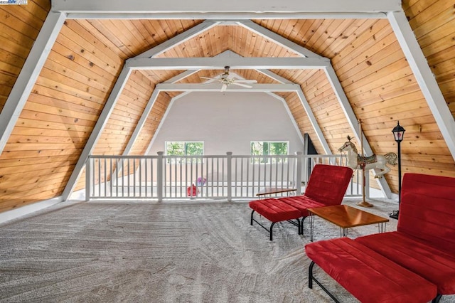 living area with wooden ceiling, carpet floors, ceiling fan, and vaulted ceiling with beams