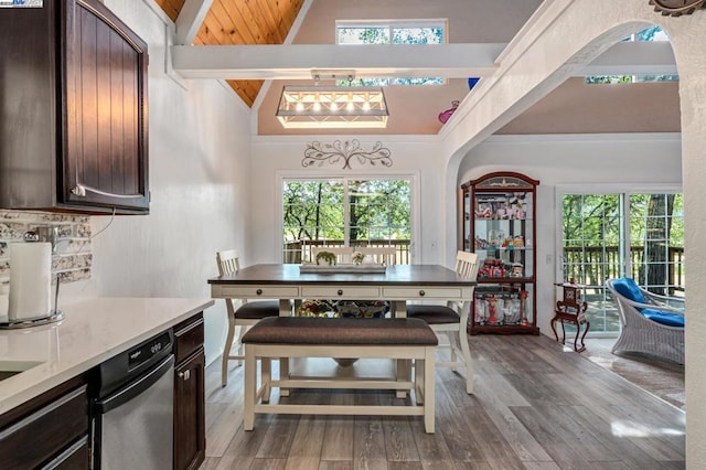 kitchen with wooden ceiling, lofted ceiling with beams, light hardwood / wood-style flooring, and dark brown cabinetry