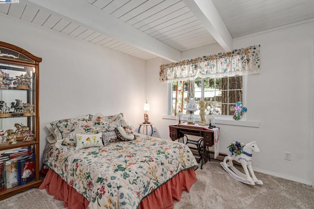 carpeted bedroom featuring beam ceiling