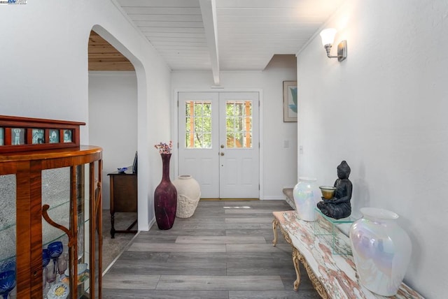 entrance foyer featuring french doors, wooden ceiling, hardwood / wood-style flooring, and beamed ceiling