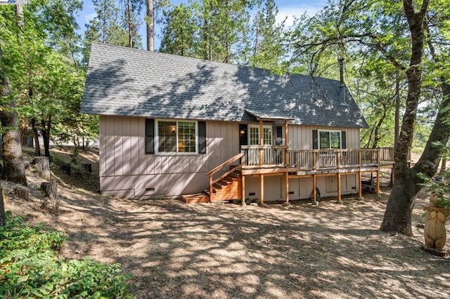 back of house with a wooden deck