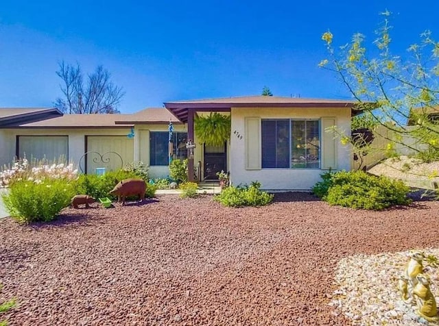 single story home featuring a garage