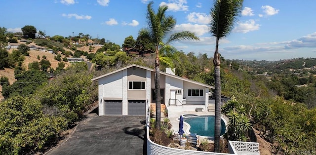 view of front of home with a garage