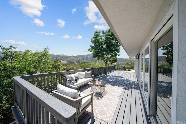 wooden deck with an outdoor hangout area