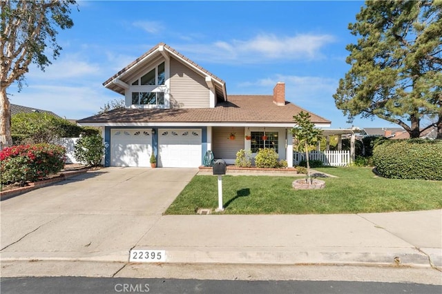 front of property with a front lawn and a garage