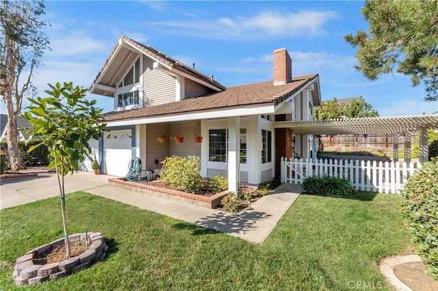 view of front of home featuring a front lawn and a garage