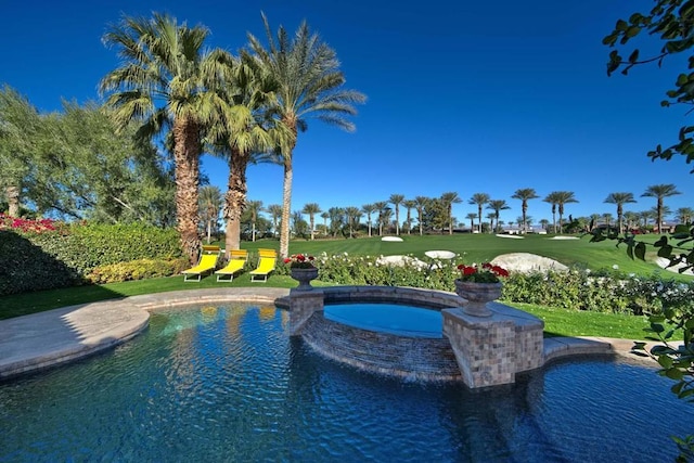 view of swimming pool featuring an in ground hot tub and a yard