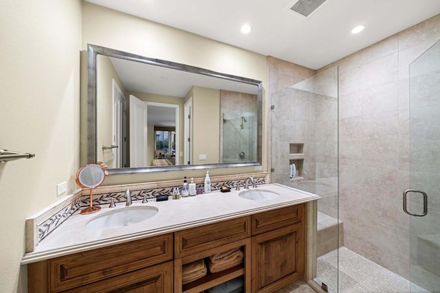 bathroom with vanity and an enclosed shower