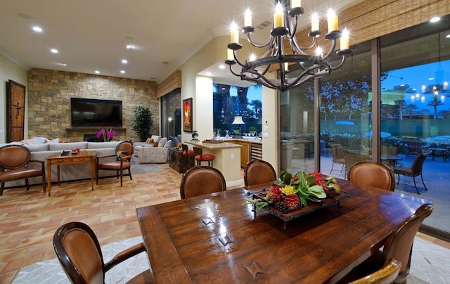 dining space with crown molding and an inviting chandelier