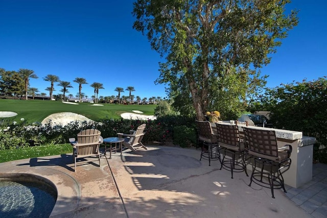 view of patio with an outdoor bar