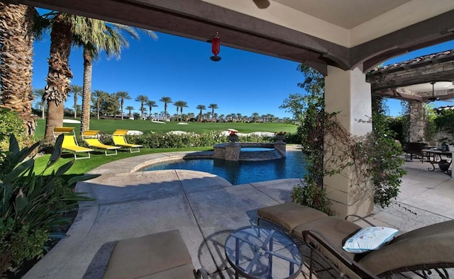 view of swimming pool with ceiling fan, a yard, and a patio