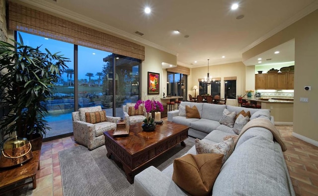 living room with crown molding and a notable chandelier