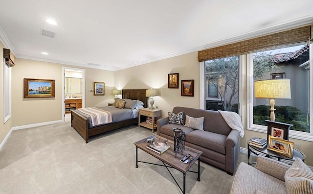 bedroom featuring ensuite bath, light colored carpet, and ornamental molding