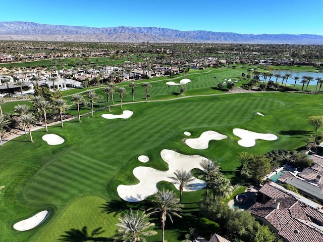 birds eye view of property with a water and mountain view