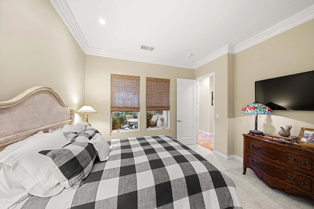 bedroom featuring crown molding and light colored carpet