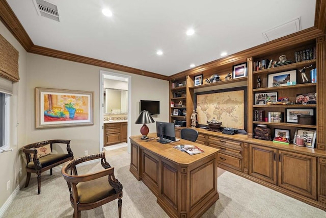 carpeted home office with built in desk and crown molding