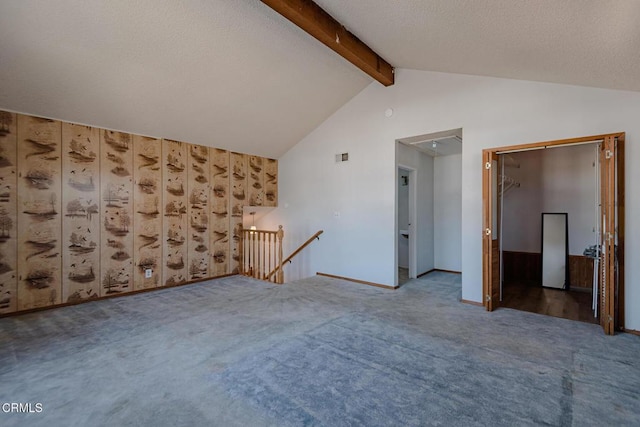 additional living space featuring carpet flooring, a textured ceiling, and vaulted ceiling with beams