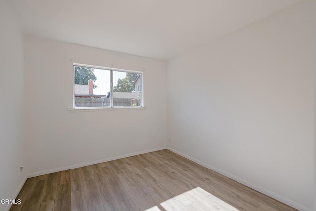 unfurnished room featuring light hardwood / wood-style flooring