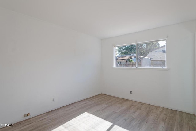 unfurnished room with light hardwood / wood-style flooring