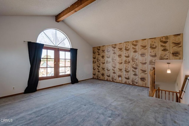 additional living space with french doors, carpet, lofted ceiling with beams, and a textured ceiling