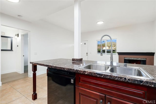 kitchen with sink, light tile patterned flooring, and dishwasher