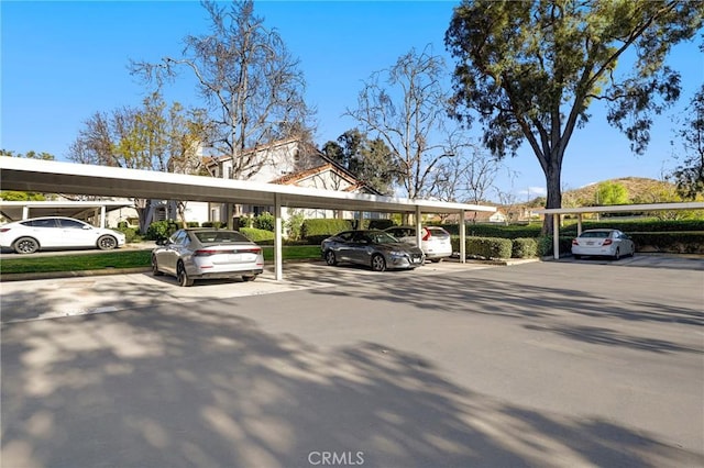 view of vehicle parking with a carport